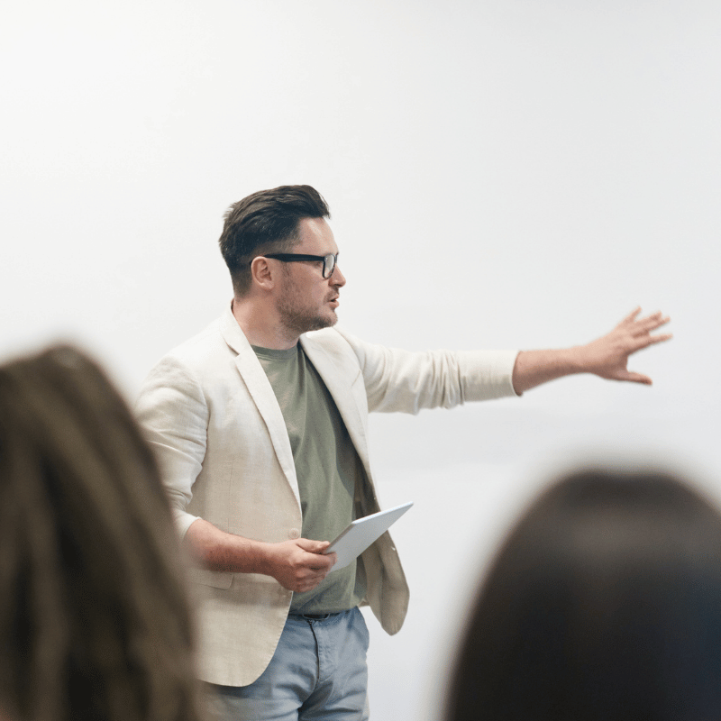 A person giving a speech in front of an audience