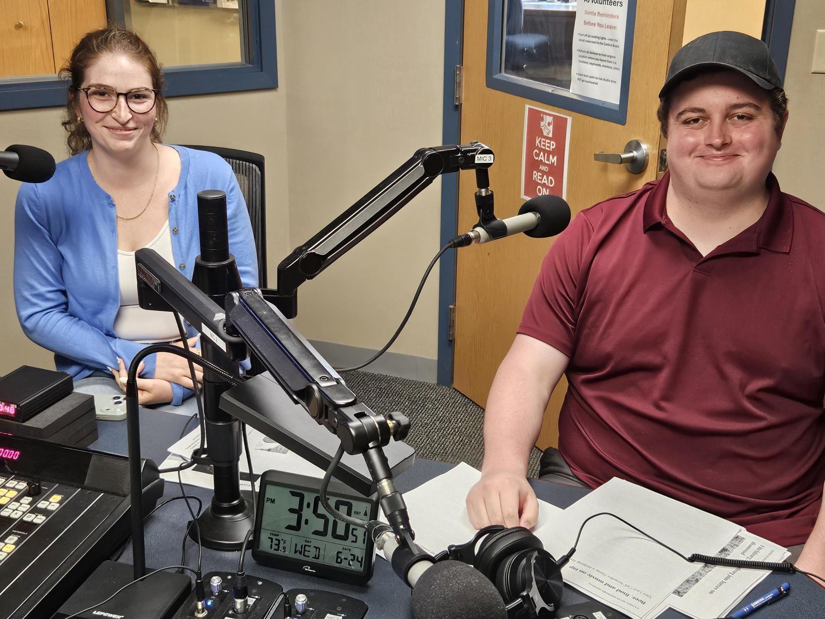 Two people sitting at a table smiling