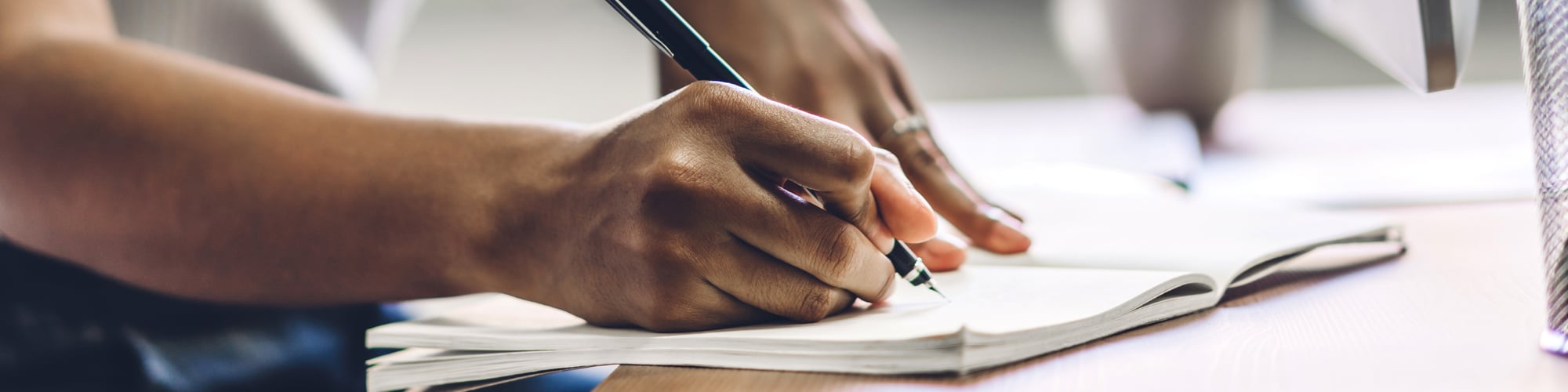 woman writing in notebook