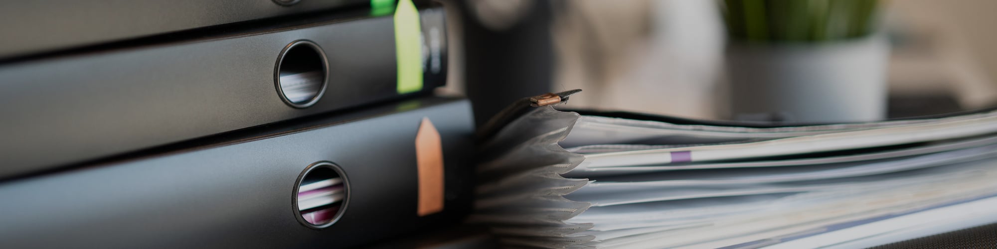 pile of binders with documents