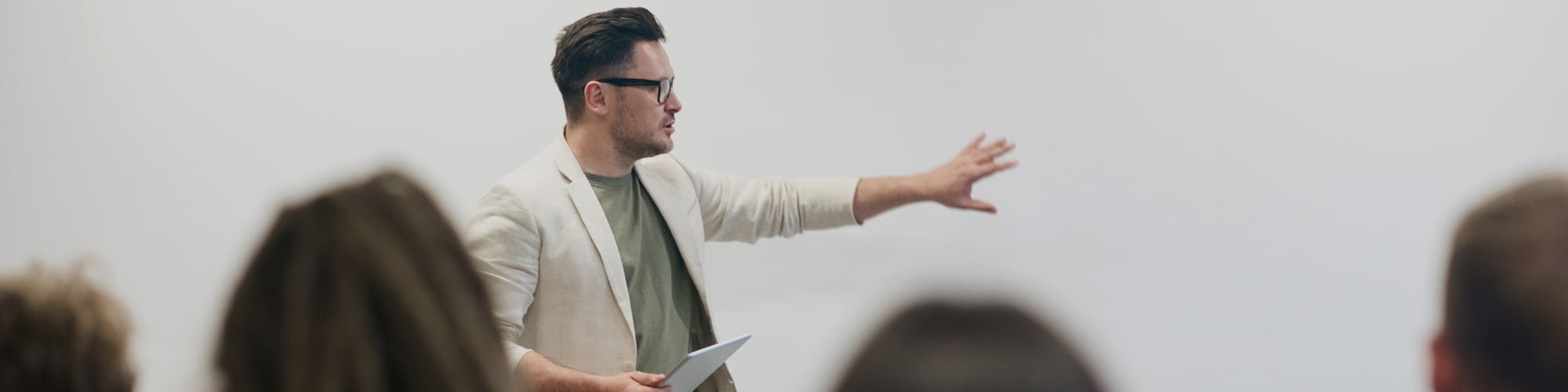A man speaking in front of an audience
