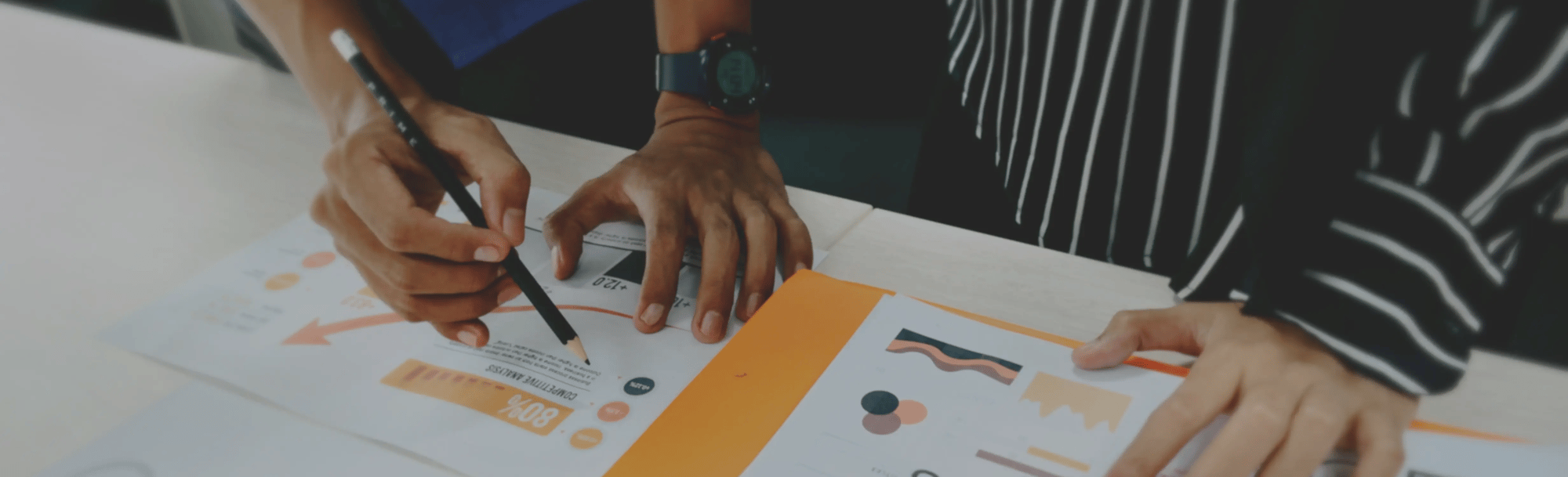 two people looking at charts